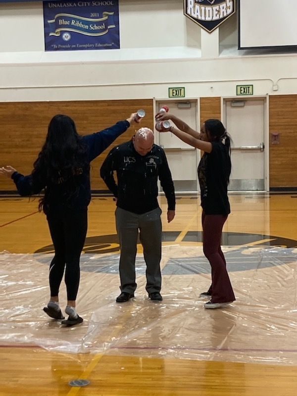 Mr. Humphrey gets sprayed with whipped cream.